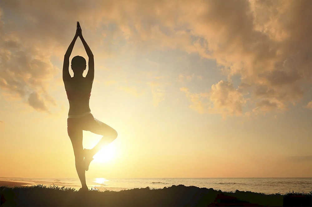 Yogahintergrund bei Sonnenuntergang
