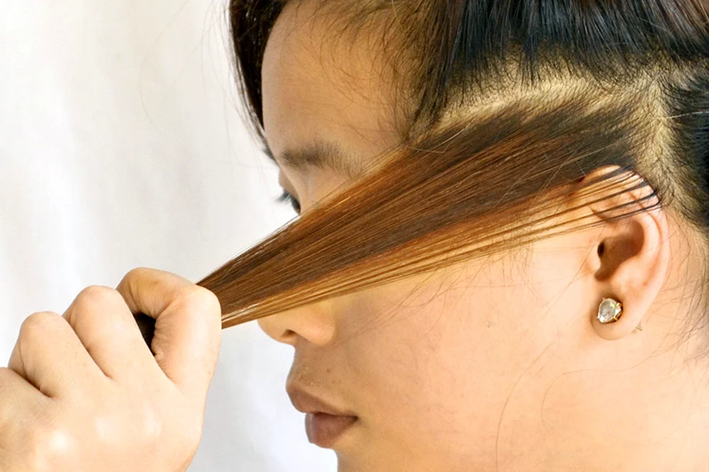 Blonde Haare Strähnen an den Ohren