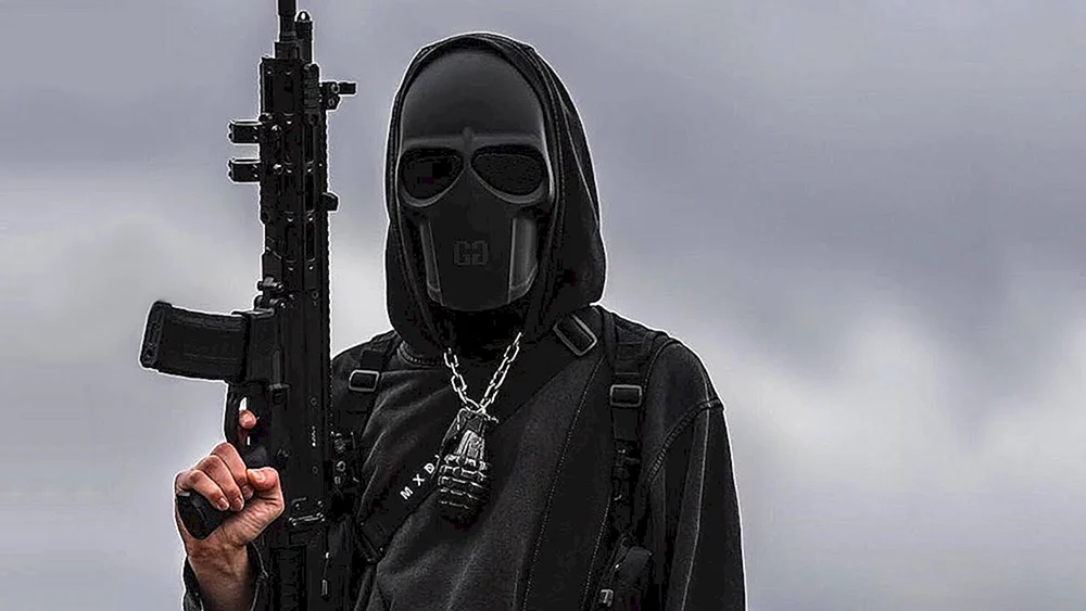 Der Totenkopf mit der Pistole in der Maske