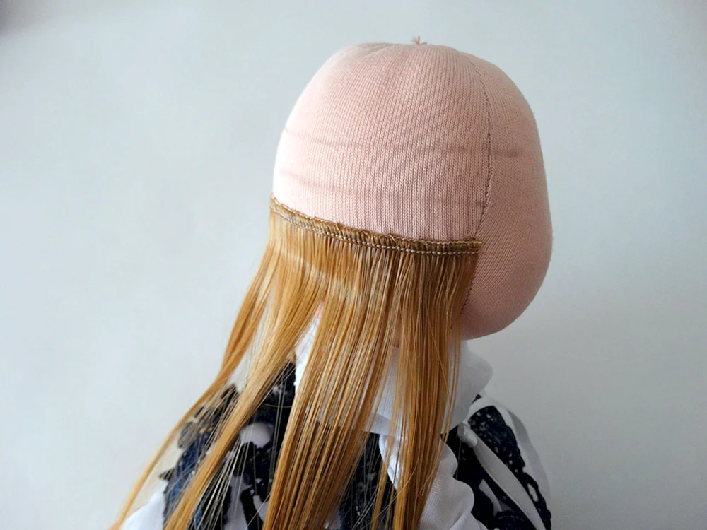 Puppenhaar aus Garn